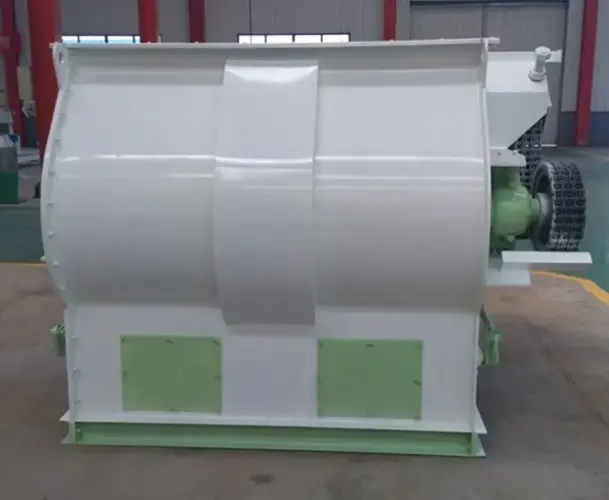 paddle type feed mixer operating in poultry feed production line factory